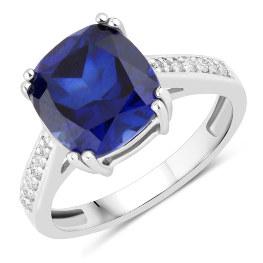 Silver ring with lab grown blue sapphire and moissanites
