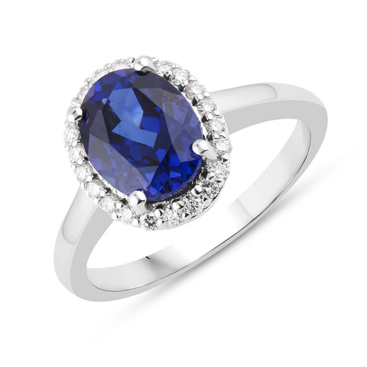 Silver ring with lab-grown oval blue sapphire and diamonds